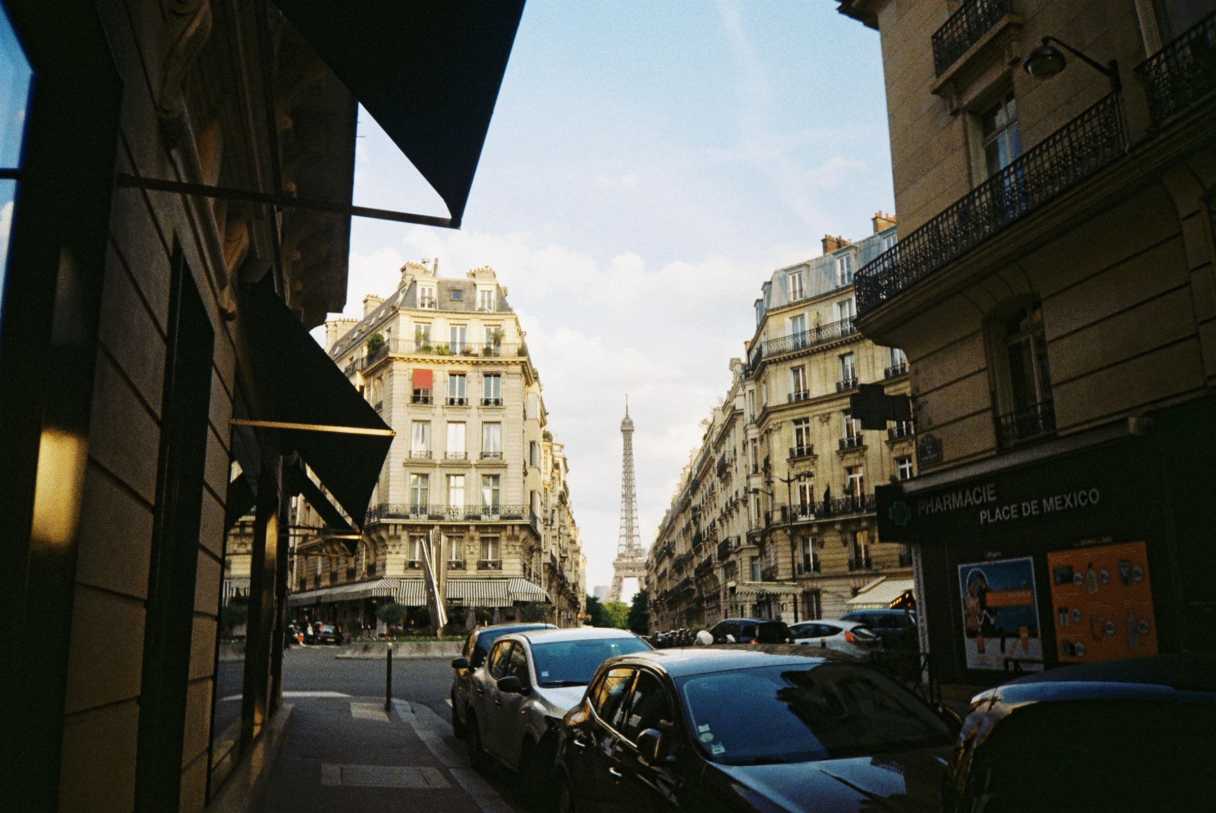 A classic Haussmann avenue framing the Eiffel Tower.